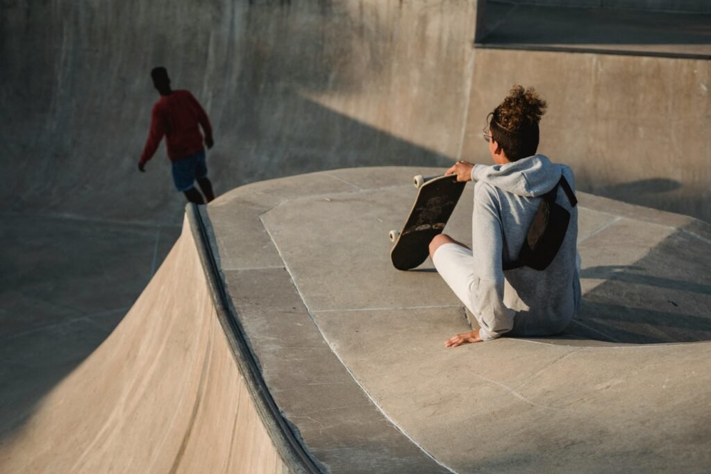 pexels-photo-5158235-5158235 Two skateboarders enjoying a sunny day at an urban skate park. Perfect for sport and lifestyle themes.